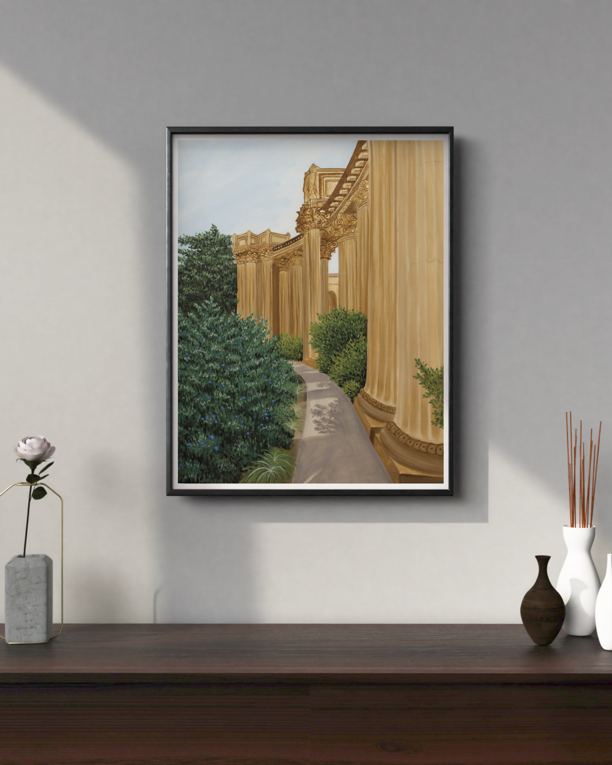 Framed artwork of a classical building with columns on a wall above a wooden shelf art print for sale