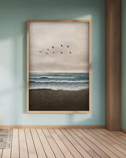 Framed artwork of birds flying over water on a wall with wooden floor.