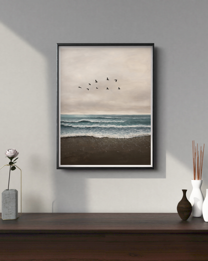 Framed artwork of birds over water on a wall above a wooden shelf with decorative items.